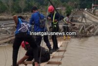 Personel Dinas Pemadam Kebakaran Kabupaten Gayo Lues bersama unsur TNI-Polri dan masyarakat mulai mengerjakan pembangunan jembatan darurat di kawasan Pintu Rime, Kecamatan Pining, Minggu (5/4/2026).